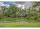 Scenic view of the pond with a dock and seating area for enjoying the outdoors at 557 Arrowhead Cir, Rutledge, GA 30663