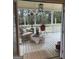 Cozy covered porch with furniture, heater and grill, perfect for outdoor entertaining at 557 Arrowhead Cir, Rutledge, GA 30663