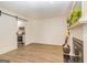 Living room with fireplace and a view of the modern kitchen through a stylish doorway at 65 Cobblestone Crk, Peachtree City, GA 30269