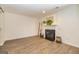 Open living room featuring fireplace, wood-look floors, decorative ladder, and ample natural light at 65 Cobblestone Crk, Peachtree City, GA 30269
