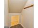 Functional storage room with coat hooks and wood-look floors, providing practical space at 65 Cobblestone Crk, Peachtree City, GA 30269