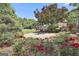 Charming backyard patio with garden views and outdoor seating at 106 Hidden Springs Ln, Peachtree City, GA 30269