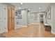 Finished basement area with wood-look floors, storage cabinets, recessed lighting, and decorative artwork at 106 Hidden Springs Ln, Peachtree City, GA 30269