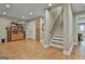 Finished basement features wood floors, staircase, and built-in bookshelves for ample storage at 106 Hidden Springs Ln, Peachtree City, GA 30269