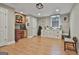 Basement area features wood-look floors, recessed lights, and a built-in desk area at 106 Hidden Springs Ln, Peachtree City, GA 30269
