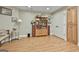 Finished basement includes a bookcase and storage cabinets, with hardwood floors and recessed lighting at 106 Hidden Springs Ln, Peachtree City, GA 30269