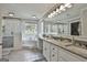 Bright bathroom with a soaking tub, walk-in shower, dual granite vanity and a window that allows for ample natural light at 106 Hidden Springs Ln, Peachtree City, GA 30269