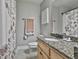A bathroom featuring granite countertops, a floral shower curtain and neutral wall color at 106 Hidden Springs Ln, Peachtree City, GA 30269
