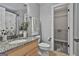 A bathroom featuring granite countertops and a floral shower curtain and view to the closet at 106 Hidden Springs Ln, Peachtree City, GA 30269