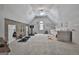 Bright bonus room with wood accent wall, exercise equipment, and daybed under a vaulted ceiling at 106 Hidden Springs Ln, Peachtree City, GA 30269