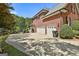 Spacious three car garage with an expansive driveway and mature landscaping at 106 Hidden Springs Ln, Peachtree City, GA 30269