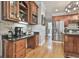 Functional kitchen area featuring custom cabinets, counterspace, and modern stainless-steel appliances at 106 Hidden Springs Ln, Peachtree City, GA 30269