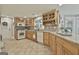 Spacious kitchen featuring wood cabinetry, stainless steel appliances and granite countertops at 106 Hidden Springs Ln, Peachtree City, GA 30269