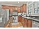 This kitchen features granite countertops, wood cabinets, stainless steel appliances and hardwood floors at 106 Hidden Springs Ln, Peachtree City, GA 30269