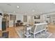 Spacious living room with hardwood floors, modern decor, and ample seating at 106 Hidden Springs Ln, Peachtree City, GA 30269