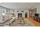 Bright living room features hardwood floors, a cozy fireplace, and stylish decor at 106 Hidden Springs Ln, Peachtree City, GA 30269