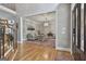 The entryway flows into a bright living space featuring hardwood floors and an ornate light fixture at 106 Hidden Springs Ln, Peachtree City, GA 30269