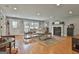 Comfortable living room with hardwood floors, fireplace, and natural light at 106 Hidden Springs Ln, Peachtree City, GA 30269
