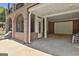 Covered outdoor patio area with access to garage and screened porch at 106 Hidden Springs Ln, Peachtree City, GA 30269