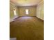 Large room with windows, ready for customization and updates at 585 Huddleston Rd, Fayetteville, GA 30214