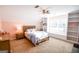 Comfortable bedroom with carpeting, dresser, bed with a blue comforter, and built-in shelves at 155 Cottage Cir, Fayetteville, GA 30215