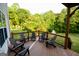 Inviting deck with seating overlooks the well-manicured backyard, ideal for relaxation and entertaining guests at 155 Cottage Cir, Fayetteville, GA 30215