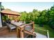 Multi-level deck includes dining and grilling areas with stairs to an outdoor trampoline and fire pit at 155 Cottage Cir, Fayetteville, GA 30215