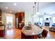 Open concept kitchen with granite island/breakfast bar, seamlessly connecting to the living room and creating a social atmosphere at 155 Cottage Cir, Fayetteville, GA 30215