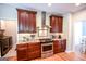 Beautiful kitchen featuring wood cabinets, granite countertops, a stylish backsplash, and stainless steel appliances at 155 Cottage Cir, Fayetteville, GA 30215