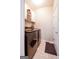 Functional laundry room featuring modern appliances, convenient storage shelves, and easy access to the adjacent areas at 155 Cottage Cir, Fayetteville, GA 30215