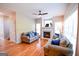 Inviting living room featuring hardwood floors, a cozy fireplace, and a serene ambiance with neutral color scheme at 155 Cottage Cir, Fayetteville, GA 30215