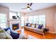 Bright living room boasting hardwood floors, a cozy fireplace, and plenty of natural light, offering a tranquil ambiance at 155 Cottage Cir, Fayetteville, GA 30215