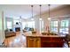 Sunlit living room featuring a cozy fireplace, neutral tones, and seamless access to the kitchen, perfect for Gathering gatherings at 155 Cottage Cir, Fayetteville, GA 30215