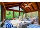 Relaxing sunroom featuring a ceiling fan, comfortable seating, and a beautiful wooded view, perfect for entertaining at 155 Cottage Cir, Fayetteville, GA 30215