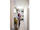 Narrow walk-in closet fitted with wire shelves, hanging rails, and carpeted floor, providing ample storage at 155 Cottage Cir, Fayetteville, GA 30215