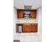 Modern wet bar featuring custom wood cabinetry, stainless steel sink, a microwave and ample counter space at 155 Cottage Cir, Fayetteville, GA 30215
