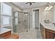 Bright bathroom featuring a glass enclosed walk-in shower and double sink vanity at 500 Cottonwood Cir, Peachtree City, GA 30269