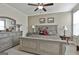 Stylish bedroom features neutral walls, patterned bedding, and a large dresser at 500 Cottonwood Cir, Peachtree City, GA 30269