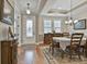 Elegant dining room showcasing hardwood floors, chandelier, and decorative furnishings at 500 Cottonwood Cir, Peachtree City, GA 30269