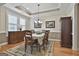 Formal dining room with hardwood floors, traditional furnishings, and natural light at 500 Cottonwood Cir, Peachtree City, GA 30269