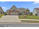 Beautiful single Gathering home with well-kept lawn, brick accents, and a two-car garage at 500 Cottonwood Cir, Peachtree City, GA 30269