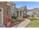 Charming home entrance with landscaped walkway, brick accents, and a covered porch at 500 Cottonwood Cir, Peachtree City, GA 30269