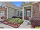Warm and inviting home entrance with stylish landscaping and decorative front door at 500 Cottonwood Cir, Peachtree City, GA 30269