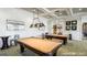 Resident game room with two pool tables, flat screen televisions, and ample seating available at 500 Cottonwood Cir, Peachtree City, GA 30269