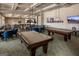Game room featuring pool tables, various table games, multiple TVs, and plenty of seating at 500 Cottonwood Cir, Peachtree City, GA 30269