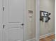 Hallway featuring a key rack, coat rack, white door and cream walls at 500 Cottonwood Cir, Peachtree City, GA 30269