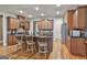 Spacious kitchen features an island with barstool seating, stainless appliances, and custom cabinetry at 500 Cottonwood Cir, Peachtree City, GA 30269
