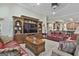 Open living area with a large entertainment center, hardwood floors, and comfortable seating at 500 Cottonwood Cir, Peachtree City, GA 30269