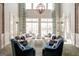 Elegant club room with comfortable sofas, high ceilings, natural light, and stylish decor at 500 Cottonwood Cir, Peachtree City, GA 30269