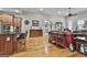 Spacious living room with hardwood floors, granite bar, and view to kitchen at 500 Cottonwood Cir, Peachtree City, GA 30269